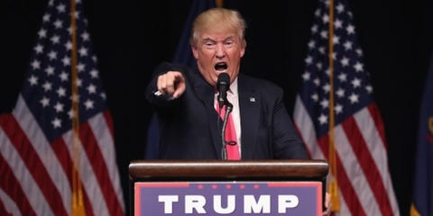 Audio equipment, Microphone, Flag, Event, Public speaking, Electronic device, Podium, Flag of the united states, Formal wear, Stage equipment,