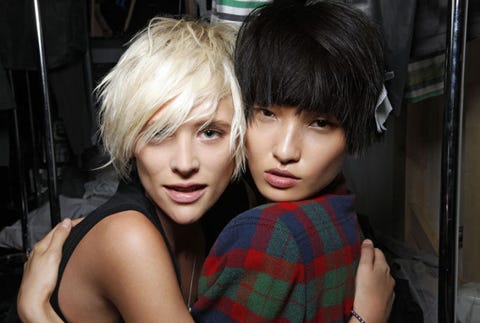 Blonde vs. Brunette women hugging