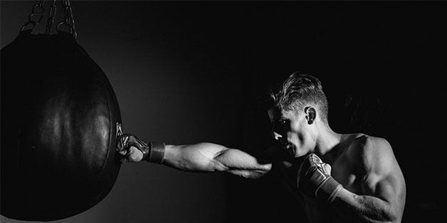 Black, Boxing glove, Boxing, Punching bag, Arm, Muscle, Photography, Flash photography, Black-and-white, Hand, 