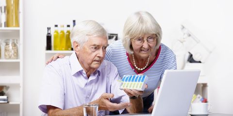 Elderly couple work out which pills to take