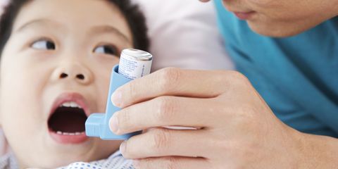 A child with an asthma inhaler