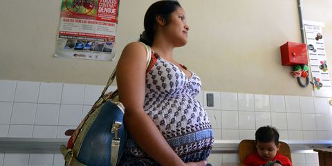 A pregnant woman waits to be attended at the Maternal and Children's Hospital in Tegucigalpa on January 21, 2016. The medical school at the National Autonomous University of Honduras (UNAH) recommended that women in the country avoid getting pregnant for the time being due to the presence of the Zika virus. If a pregnant woman is infected by the virus, the baby could be born with microcephaly