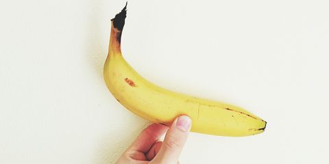 Hand holding a banana