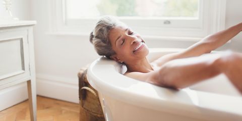 Woman relaxing taking a bath