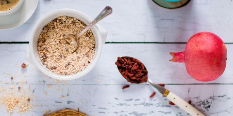 Quinoa breakfast bowl, rice milk, pomegranate, goji berries and coffee