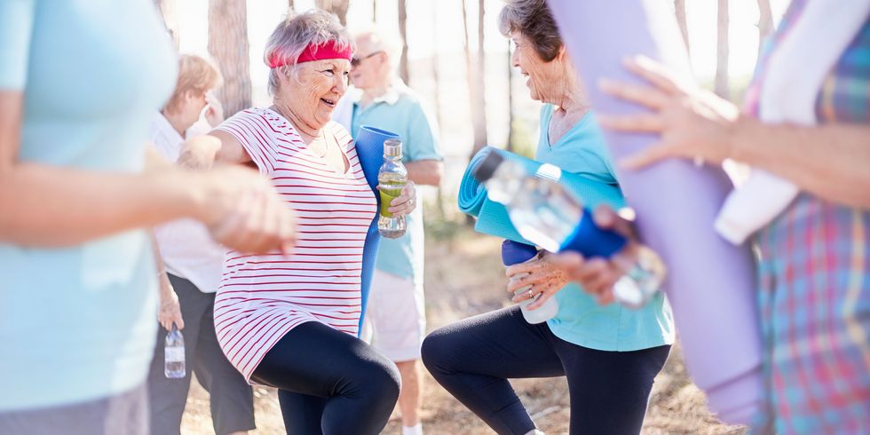 Two older women exercising together