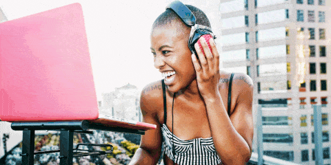 Woman DJ'ing headphones