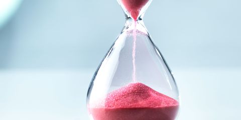 Hour glass with red sand