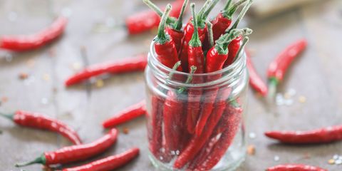 Red chilli peppers in a jar