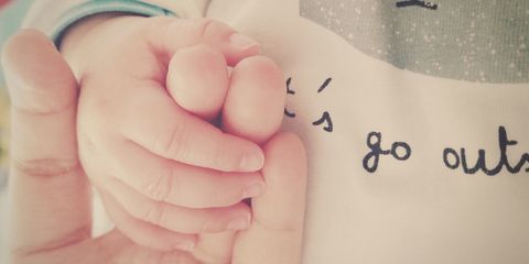 Cropped Image Of Parent Holding Child Hand
