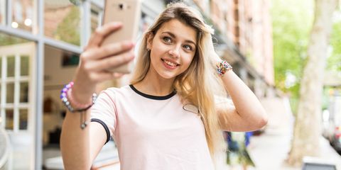 Teenage girl taking selfie