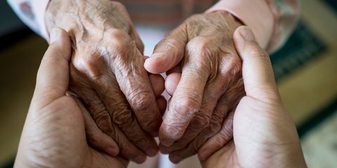 Elderly hands holding