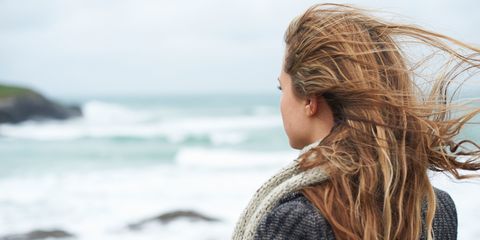 Woman looking out to sea back of head