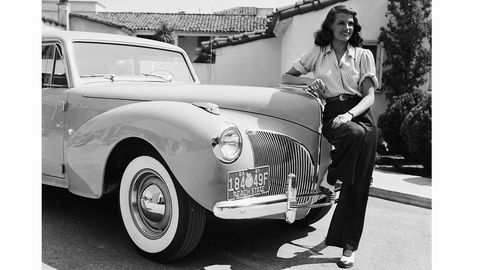 1941: American screen beauty Rita Hayworth (1918 - 1987) poses beside a Lincoln. (Photo via John Kobal Foundation/Getty Images)