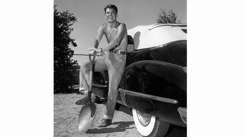 1948: American leading man and future President of the United States  Ronald Reagan, ready to start digging next to his Cadillac Convertible.  (Photo via John Kobal Foundation/Getty Images)