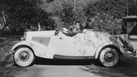 26th September 1934: American actress Joan Crawford (1904 - 1977), goes for a drive in her '34 Ford convertible. (Photo via John Kobal Foundation/Getty Images)