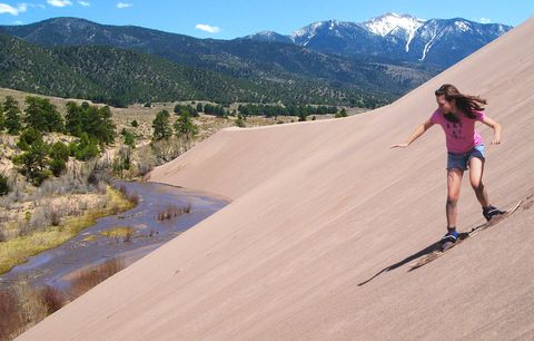 Mosca: Zip down 750-foot hills at <a target="_blank" href="http://www.nps.gov/grsa/index.htm">Great Sand Dunes National Park</a> on a sled (from the Oasis Store) built for the desert.