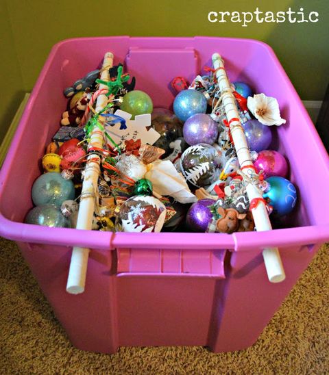 <p>You'll know your ornaments are ready to be hung as soon as you pull them out next year if you loop the ribbon onto wooden rods in a plastic bin while they're in storage. This tip works well for "shatter-proof" balls — but consider storing your favorite glass heirloom ornaments in individual containers.</p><p><a href="http://craptastickatie.blogspot.com/2013/01/cheap-and-easy-diy-christmas-ornament.html" target="_blank"><em>Get the tutorial at Craptastic »</em></a></p>