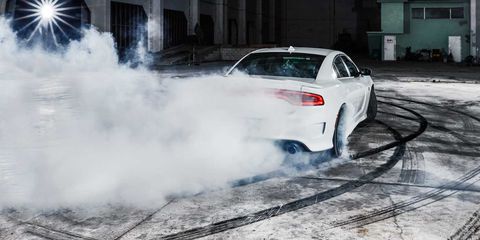 <p>The Dodge Charger SRT Hellcat is the highest expression of America's muscle-bound past. It's a V-8, it's rear-wheel-drive, and it's certifiably huge—elements that ought to trigger nostalgia. But in its outsize ambitions, the Hellcat is something new. From the bones of a sub-$30,000 fleet car, Chrysler builds a projectile that tops out at 204 mph. Last year Jeff Gordon qualified at pole position for the Daytona 500 with a speed of 201 mph.</p><p>The Hellcat has strong brakes and decent suspension, but those components come across as afterthoughts compared with the effort that went into the engine, a supercharged 6.2-liter V8 that makes 707 horsepower. That V8 is the Hellcat's defining feature, all thunderous exhaust and <em>Mad Max</em> supercharger whine, the centerpiece of the world's most powerful internal-combustion sedan. Perhaps as a joke, or a taunt to fellow carmakers, the Hellcat comes with two keys: a red one that unleashes full power, and a black one that's ostensibly for valets and newbie drivers. With the latter key, in safety mode, the Hellcat is limited to about 500 horsepower. You know, just three Miatas' worth. Sensible. </p><p><iframe width="500" height="281" src="//www.youtube.com/embed/ZKE535zlsl8" frameborder="0" allowfullscreen=""></iframe><br></p>