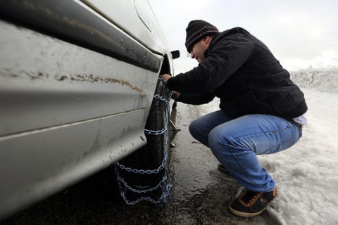 <p>Many states don't require passenger vehicles to use chains for winter driving. And generally, our experts agree that winter tires outperform chains on most surfaces. But in some states, where the majority of the residents live in a dry hot climate, you might need to carry chains into the mountains—even if you have mud and snow rated truck tires or even proper winter tires. "Most people wait until the last possible minute to chain up," says Debogorski. "I get it, they're inconvenient. But if you see people stuck or spinning their tires, put on your chains." He admits that even he was resistant to putting them on in his younger days. He says, "They'd tell us to chain up and I wouldn't. I made it up the mountain because the guys using the chains would chew up the snow and give me the traction, not because I was the better driver." He advises winter drivers to use a designated safe area, like an official vehicle chain-up area to install your chains. But be sure to practice putting them on in your driveway once or twice—so the process will be smooth and easy in the field. Foust cautions against cheap chains that don't cover the whole tread in an "X" or "Z" pattern. "If the chains are the type that only go across the tread linearly, they have a tendency to skate sideways across the road," says Foust. "I've seen cars literally track on ice sideways at a near dead stop because they were skating on the chains." </p>