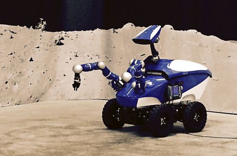 A screen shot taken on September 7, 2015 shows the Interact Centaur rover remotely guided by an astronaut from the International Space Station (ISS). While orbiting some 400 kilometres (250 miles) above Earth, Danish astronaut Andreas Mogensen took control of the Interact Centaur rover which has a pair of arms for delicate, high-precision work, under the careful control of the European Space Agency. The blue-and white fibre-glass robot, which cost less than 200,000 euros ($224,000) to build, also has a camera head on a neck system which will allow the controller to directly see the task it is performing