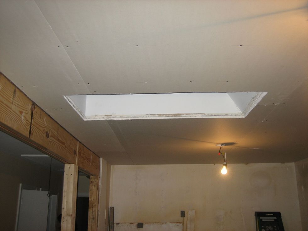<p>Create less mess and work later by scoring the area between the wall that you are tearing down and the ceiling. This will prevent the sheetrock that you are removing from the wall taking down pieces of the ceiling with it.</p>