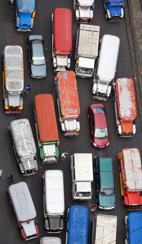 Overhead view of a snarl of jeepneys clogging a main road at Divisoria Market.
