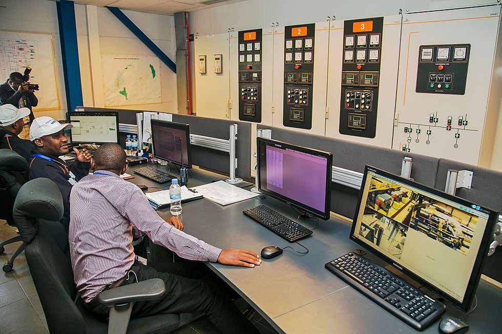 Employees in a KivuWatt control room.
