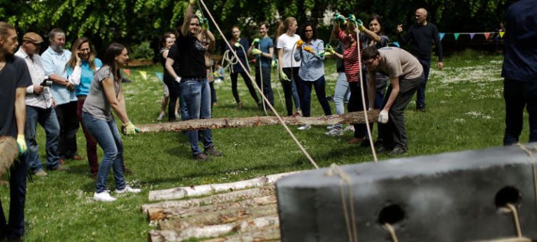 College kids moving one-ton stones like they might have done in Stonehenge.