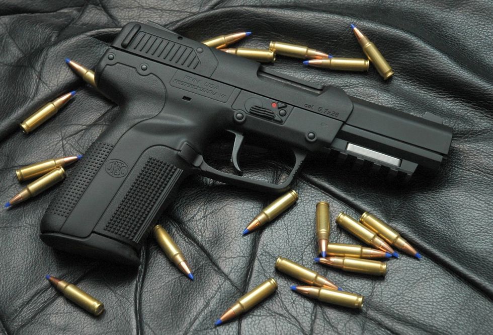 Gun, Ammunition, Firearm, Trigger, Gun accessory, Bullet, Air gun, Metal, Gun barrel, Everyday carry, 