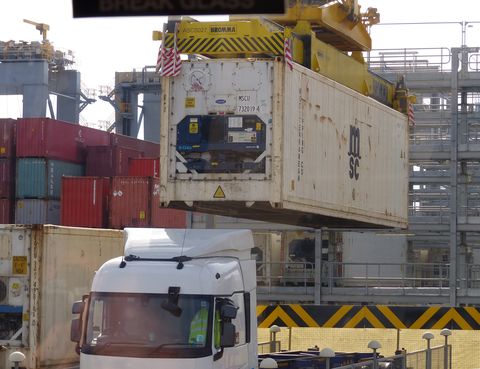 <p>To leave the port for its next destination, the container is loaded on to a truck or railcar. This process is also completely&nbsp;automated. The driver parks&nbsp;in a specified bay, then steps away from the vehicle for safety reasons. The stacking crane does the rest, automatically locating the correct container in the stack, picking it up, and bringing it over.&nbsp;</p><p><br></p><p>The stacking crane lines up the container with the truck bed and lowers it&nbsp;into place. &nbsp;All the driver needs to do is secure the load before heading off. Then, an&nbsp;optical character reader confirms the container's box number on the way out. The whole process&nbsp;takes about five minutes.</p><p>If you want to see the whole operation at work, can watch this timelapse video:<br></p><p><br></p><p><iframe width="500" height="281" src="//www.youtube.com/embed/B8GxkTsmssg" frameborder="0" allowfullscreen=""></iframe><span class="redactor-invisible-space" data-verified="redactor" data-redactor-tag="span" data-redactor-class="redactor-invisible-space"></span><br></p><p><br></p><p>Once completely unloaded, this complicated&nbsp;dance of advanced machinery, global commerce, and&nbsp;human ingenuity begins anew&nbsp;as the Al Zubara<span class="redactor-invisible-space" data-verified="redactor" data-redactor-tag="span" data-redactor-class="redactor-invisible-space"> preps for&nbsp;its next voyage.&nbsp;</span></p>