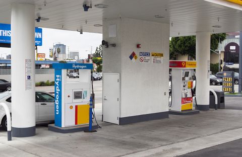 Filling station, Gas pump, Gasoline, Fuel, Machine, Business, Gas, Vehicle door, Chemical substance, Parking, 