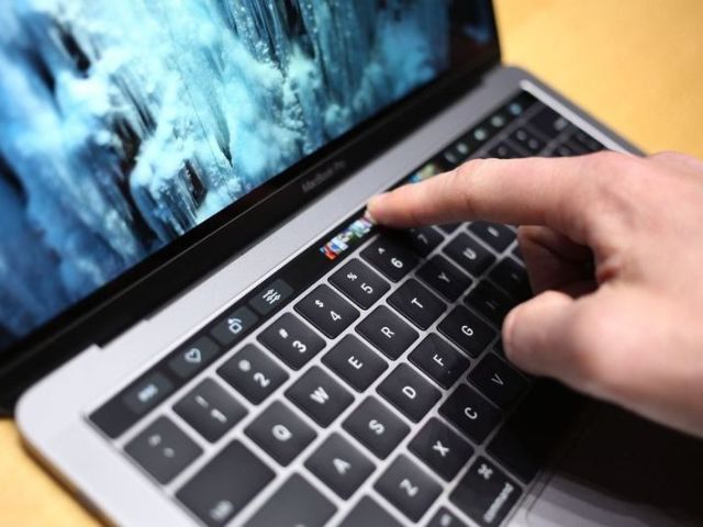 Hacker finally makes the MacBook Pro's Touch Bar useful on Windows -  MSPoweruser