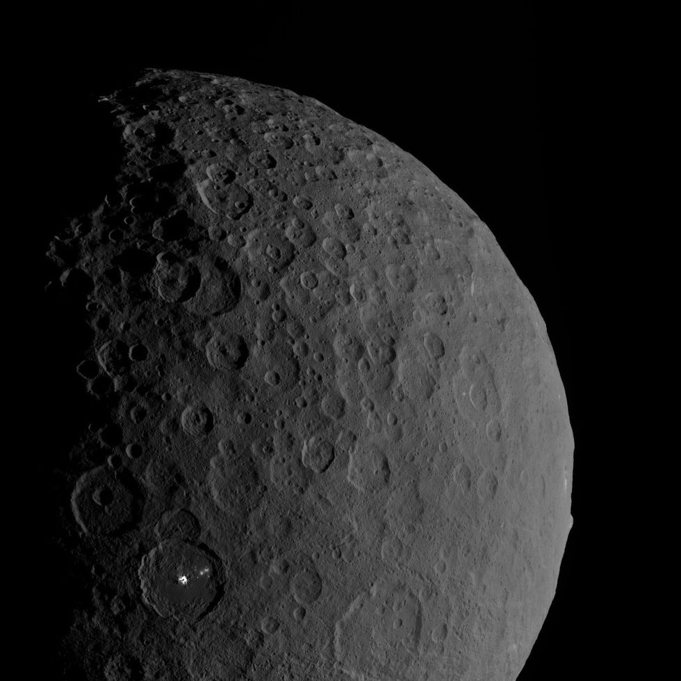 Occator and Ahuna in the same shot. Occator has the bright white material in it, Ahuna is the bump on the far right.