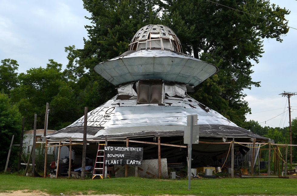 <p>In Bowman, South Carolina, a man named Jody Pendarvis built a trash castle monument to our alien overlords called the UFO Welcome Center. Pendarvis allows visitors to his rickety outsider art project. The idea reportedly struck him in the 1990s (sort of like the potato Devil's Tower in&nbsp;<em data-verified="redactor" data-redactor-tag="em">Close Encounters of the Third Kind,&nbsp;</em><span class="redactor-invisible-space" data-verified="redactor" data-redactor-tag="span" data-redactor-class="redactor-invisible-space">but made out of sheet metal) and <a href="http://fox6now.com/2013/04/07/man-creates-ufo-welcome-center-in-south-carolina/" data-tracking-id="recirc-text-link">by Memorial Day 1999</a>, it was open for business.</span></p>