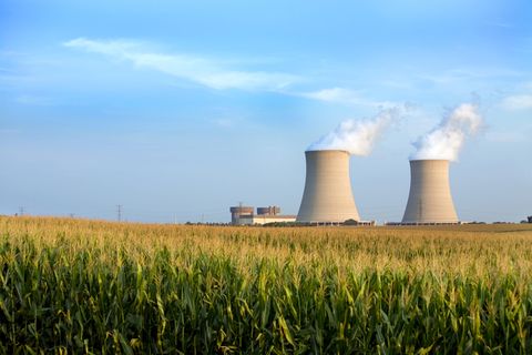 Nuclear power plant, Power station, Cooling tower, Sky, Computer, Technology, Grass family, Electronic device, Computer component, Field, 