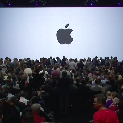 People, Crowd, Product, Display device, Audience, Apple, Fruit, Logo, Presentation, Projection screen, 