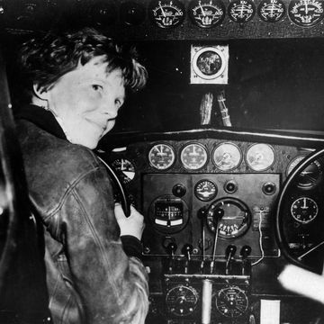 Amelia Earhart in the cockpit of  a plane
