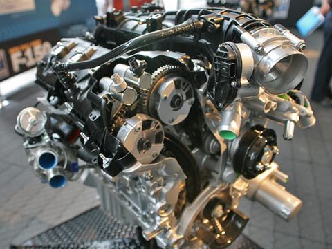 The Ford F-150 3.5-liter EcoBoost V-6 features dual, independent intake and exhaust camshaft timing. The two circles at the end of each cam are the hydraulic cam phasers. The engine produces 365 hp and 420 lb-ft torque. The non-truck 3.5-liter only uses variable intake cam timing and has lower-flow turbos.