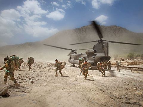 These men are running off of the Chinok helicopter on day one of the mission Afghanistan, south east tip of Paktika Province, Town of Kalay, 10 miles from the Pakistan Border. May, 2009.