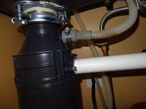 how to remove a garbage disposal knockout plug