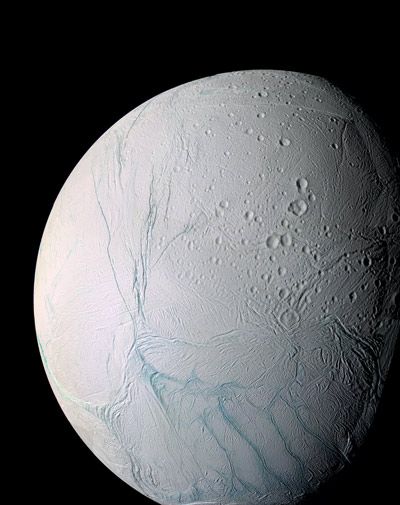 Enceladus and its "tiger stripes," the long fractures from which the water vapor jets emit.