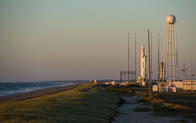 The Orbital Sciences Corporation Antares rocket, with its Cygnus cargo spacecraft aboard, is seen during sunrise on the Mid-Atlantic Regional Spaceport Pad-0A at the NASA Wallops Flight Facility September 17, 2013 in Wallops Island, Virginia. 
