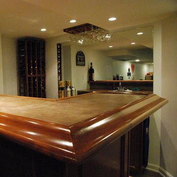 Countertop, Room, Furniture, Property, Lighting, Cabinetry, Interior design, Table, Basement, Wood, 