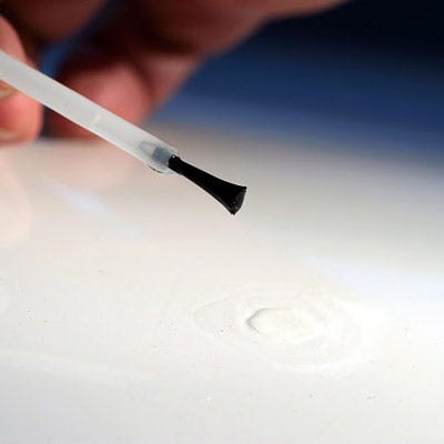 Finger, Hand, Nail, Writing instrument accessory, Material property, Office supplies, Writing, car paint repair chips