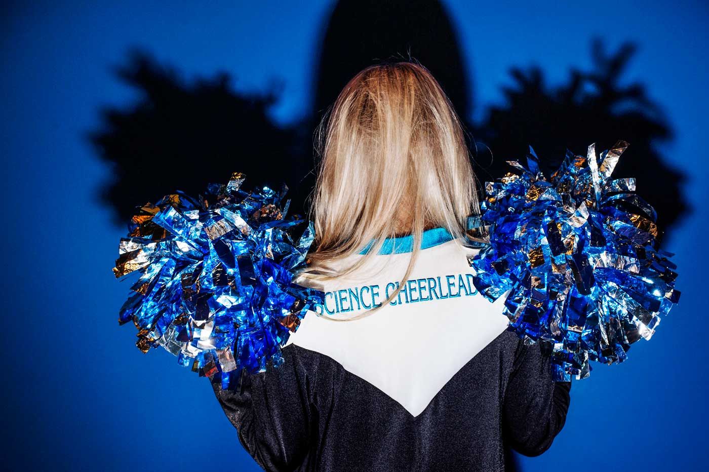 Three Female Cheerleaders Holding Pompoms High-Res Stock Photo - Getty  Images