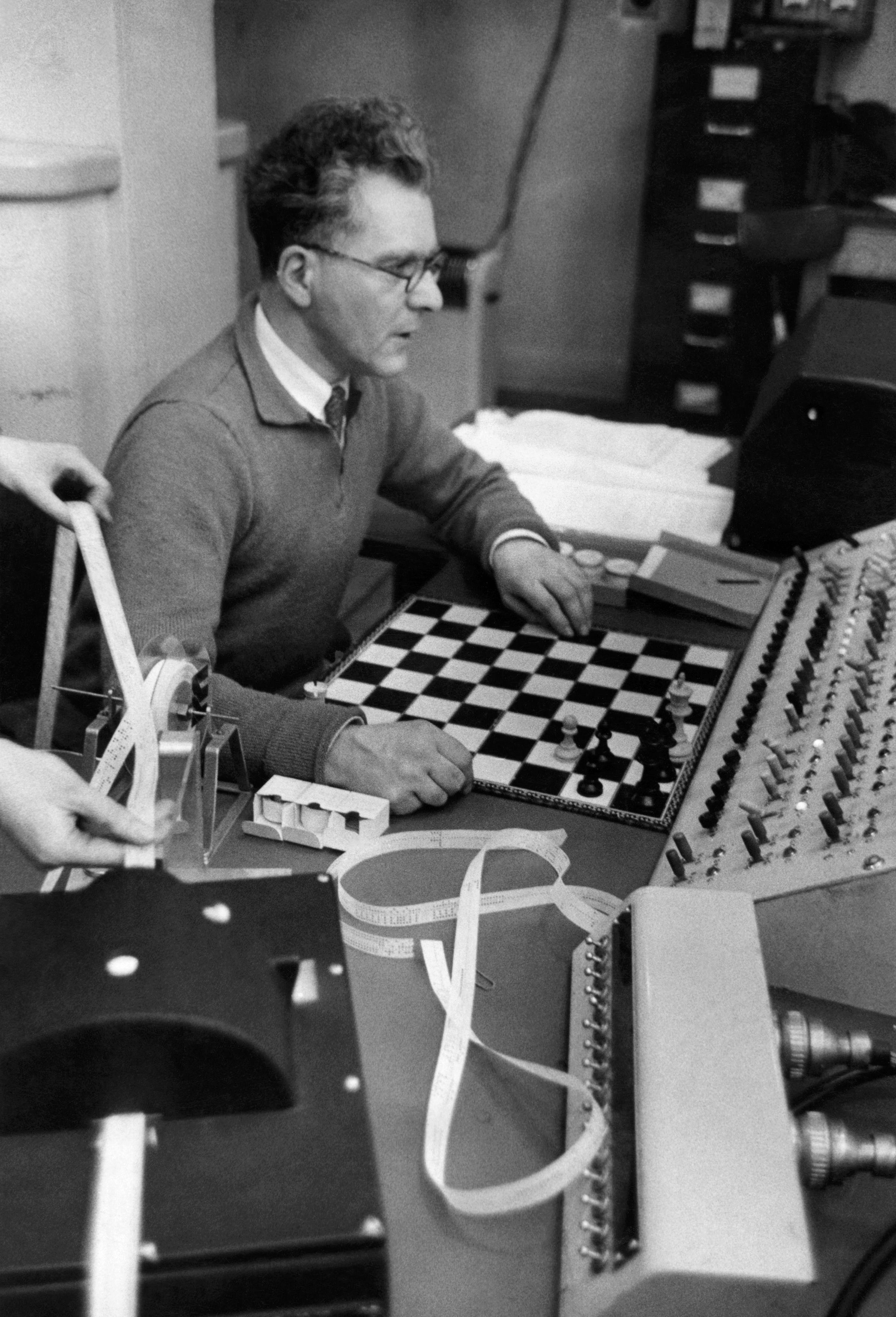 Caucasian man playing chess computer hi-res stock photography and