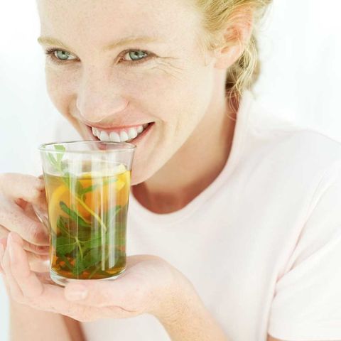 Woman drinking green tea