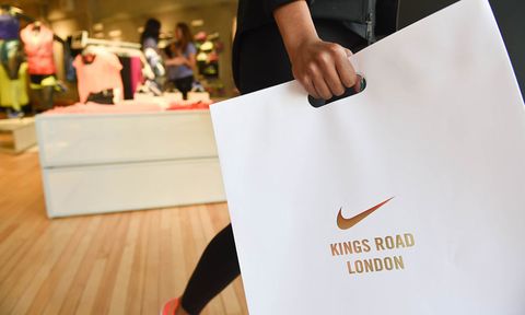Girl in black lycra carrying a Nike Kings Road bag