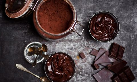 Chocolate mousse and cocoa powder in jars